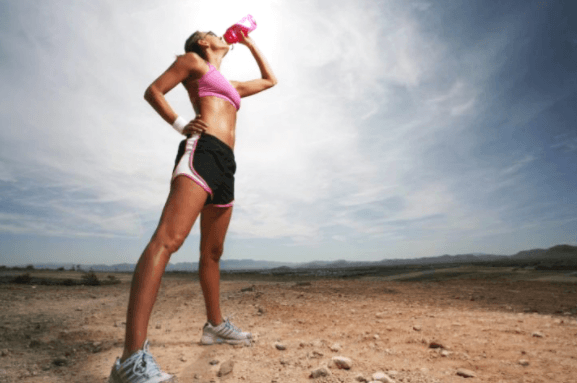 woman drinking on a run break